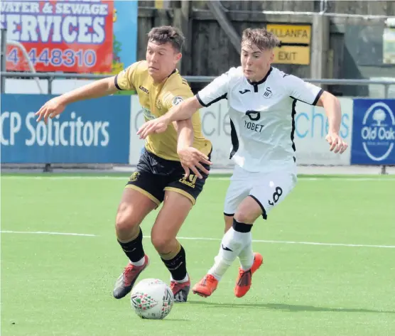  ?? Picture: Phil Davies. ?? Carmarthen Town, pictured playing Swansea City Under-23s last season, are building for the future.