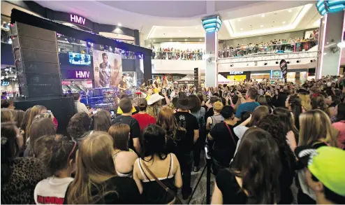  ?? CODIE McLACHLAN / POSTMEDIA NEWS FILES ?? A concert at HMV Stage in 2014 at West Edmonton Mall. HMV, which first opened its stores in Canada in 1986, was placed into receiversh­ip in Ontario Superior Court on Friday.