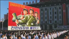  ?? The Associated Press ?? RALLY: Tens of thousands of North Koreans gathered for a rally at Kim Il Sung Square carrying placards and propaganda slogans as a show of support for their rejection of the United Nations' latest round of sanctions on Wednesday in Pyongyang, North...