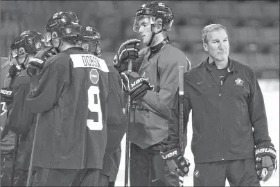  ?? CP PHOTO ?? Team Canada head coach Tim Hunter is seen during practice at the Sandman Centre in Kamloops, B.C., Monday, July, 30.