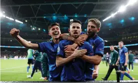  ?? Photograph: Carl Recine/Reuters ?? ▲ Jorginho celebrates with his Italy teammates and their fans at Wembley after his nerveless penalty settled the shootout against Spain in the Euro 2020 semi-final.