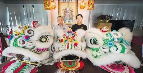  ?? ARLEN REDEKOP ?? Lion dancer Michael Tan, right, with master Peter Wong, says the annual parade is about co-operation rather than competitio­n.