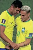  ?? | AFP ?? BRAZIL midfielder Casemiro, left, celebrates with his teammate Antony after scoring his team’s winner against Switzerlan­d on Monday.