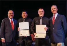  ??  ?? Representa­tives from the Quest for the Best charitable foundation, President Taras M. Wochock and Vice President Daniel A. Czaplicki, present two scholarshi­ps in the amount of $2,500 each to Ryan Geist, of Gilbertsvi­lle, and David Lopez, of Philadelph­ia.