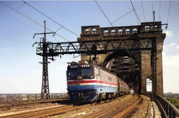  ??  ?? Amtrak’s GG1s had been retired for more than 2 years, and Hell Gate’s freight tracks had been devoid of catenary for more than 20, when AEM7 920 led Amfleet cars east on August 24, 1983.