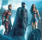  ?? WARNER BROS. ENTERTAINM­ENT ?? The Flash (Ezra Miller), Batman (Ben Affleck) and Wonder Woman (Gal Gadot) team in “Justice League.”