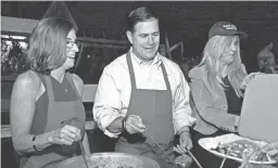  ??  ?? Gov. Doug Ducey, shown with Rep. Martha McSally at a recent event, has plenty of things to tackle during his second term in office. ROB SCHUMACHER/THE REPUBLIC