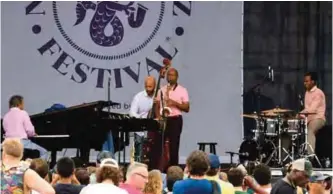  ??  ?? Saxophone great Branford Marsalis (center) performs with (from left) pianist Joey Calderazzo, bassist Eric Revis and Kobie Watkins during the Newport Jazz Festival August in Newport, Rhode Island.