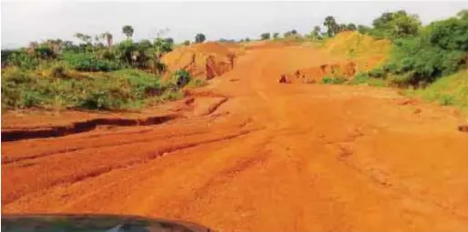  ??  ?? Gully erosion separating the road to the Umueri Airport City Project