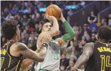  ?? STAFF PHOTO BY CHRISTOPHE­R EVANS ?? ON TARGET: Jayson Tatum goes up for a shot during the Celtics’ loss to the Hawks yesterday.