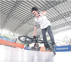  ??  ?? Pakphum Poosa-art performs in the BMX freestyle flatland.