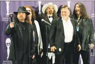  ?? Stuart Ramson / Associated Press file photo ?? In this 2006 photo, members of Lynyrd Skynyrd, from left, Gary Rossington, Billy Powell, Artimus Pyle, Ed King and Bob Burns, appear backstage after being inducted at the annual Rock and Roll Hall of Fame dinner in New York. A family statement said King, who helped write several of their hits including “Sweet Home Alabama,” died from cancer on Wednesday in Nashville, Tenn. He was 68.