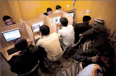  ?? AP/B.K. BANGASH ?? Web users get online at a cafe last week in Islamabad.