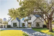  ??  ?? The Palafoxes’ Tanglewood home is stucco and stone, and a pair of oversized gas lanterns by Sheryl Stringer flank the front door.