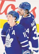  ?? NATHAN DENETTE THE CANADIAN PRESS ?? Mitch Marner, left, and Maple Leafs teammate Auston Matthews hang their heads after being knocked out of the playoffs.