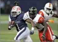  ?? CHRIS O’MEARA — THE ASSOCIATED PRESS ?? West running back Eli McGuire of Louisiana-Lafayette gets past East linebacker Andrew King (11) of Army, and safety Jamal Carter Sr., (6), of Miami, for a touchdown in the East West Shrine game Saturday in St. Petersburg, Fla.