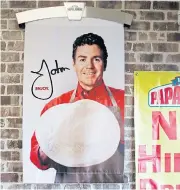  ?? AP ?? This Dec 21, 2017 file photo shows signs, including one featuring Papa John’s founder John Schnatter, at a Papa John’s pizza store in Quincy, Massachuse­tts.