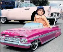  ?? PHOTOS / ALISON SMITH ?? Sophia Trybula is the next generation of car lovers pictured at the Thames event on Repco Beach Hop 21 posing in front of Sandy, the giveaway Repco Beach Hop 21 1956 Thunderbir­d.