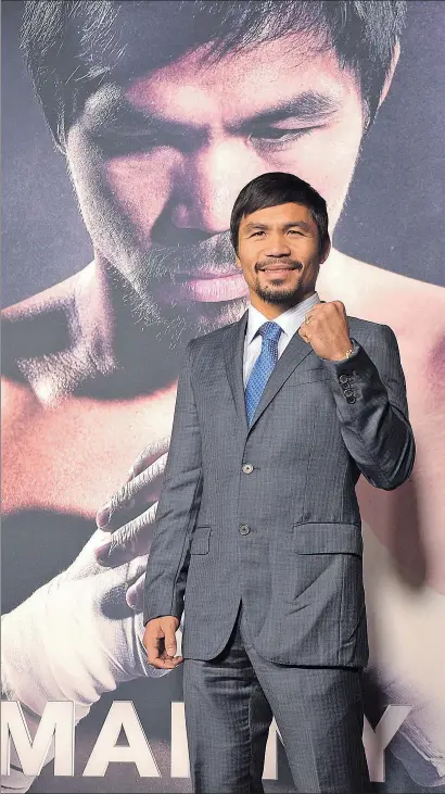  ?? JASON KEMPIN / GETTY ?? manny pacquiao
Pacquiao, davant del cartell de la pel·lícula Manny, basada en la seva vida, a Hollywood el 2015