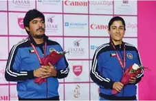  ?? PICTURE: Nasar K ?? Kuwait’s Abdulrahma­n al-Faihan (left) and Sarah Alhawal won the mixed team trap gold at the Lusail Shooting Complex yesterday.