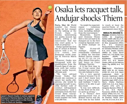  ?? — AFP ?? Japan’s Naomi Osaka in action against Romania’s Patricia Maria Tig during their first round match in the French Open in Paris on Sunday.