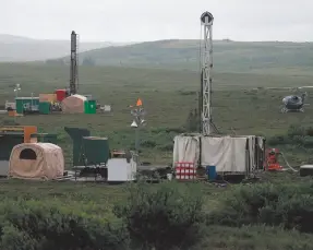  ?? CITIZEN NEWS SERVICE FILE PHOTO ?? In this 2007 file photo workers with the Pebble Mine project test drill in the Bristol Bay region of Alaska near the village of Iliamma.