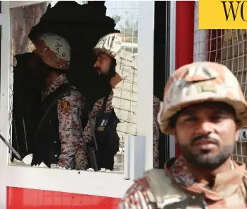  ?? SHAKIL ADI/THE ASSOCIATED PRESS ?? Pakistani troops patrol the compound of the Chinese consulate in Karachi, Pakistan, on Friday, after gunmen stormed the building, triggering an intense shootout that saw two police, two civilians and three attackers die.