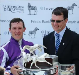  ?? WARREN LITTLE / GETTY IMAGES ?? Aidan O’Brien with jockey Padraig Beggy after Wings Of Eagles’ victory in the Investec Derby at Epsom in June 3