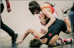  ?? NATE HECKENBERG­ER - FOR MEDIANEWS GROUP ?? Haverford’s Cole McFarland, top, scrambles with Boyertown’s Gavin Sheridan before pinning Sheridan in the 106-pound semifinals at the District 1Class 3A South tournament. McFarland finished second.