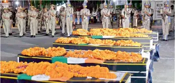  ?? — PTI ?? Jawans give gun salute to martyred CRPF personnel at Patna on Tuesday.