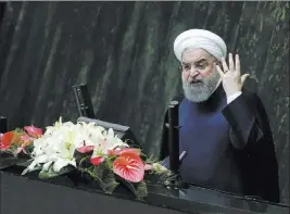  ?? Vahid Salemi ?? The Associaed Press Iranian President Hassan Rouhani speaks Sunday at a session of parliament before a vote of confidence for his Cabinet.