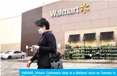  ??  ?? CHICAGO, Illinois: Customers shop at a Walmart store on Tuesday in Chicago, Illinois. – AFP