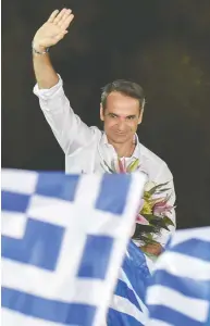  ?? LOUISA GOULIAMAKI / AFP / GETTY IMAGES FILES ?? New Democracy leader Kyriakos Mitsotakis waves to supporters in Athens days before he was elected PM.