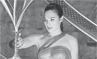  ?? ALEX BAILEY, WARNER BROS. ?? Diana Prince (Gal Gadot) steals the sword from the Amazons before setting off to war.