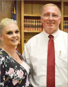  ?? TIMES photograph by Annette Beard ?? Pea Ridge Police Chief Lynn Hahn and his wife, Tammy, were congratula­ted after the City Council meeting at which Mayor Jackie Crabtree named Hahn as the new police chief filling a vacancy that was created Dec. 1, 2018.