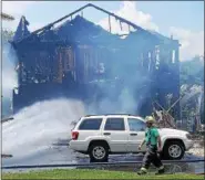  ?? MARIAN DENNIS — DIGITAL FIRST MEDIA ?? A fire destroyed a home on the 100 block of Gristmill Lane. No injuries have been reported.