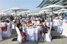  ??  ?? A guest capturing the mood at Breakfast With The Stars ahead of Dubai World Cup at Meydan yesterday.