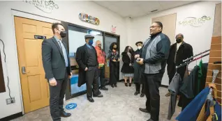  ?? KYLE TELECHAN / POST-TRIBUNE PHOTOS ?? Smart Dog technology owner Milton Thaxton Jr., right, speaks with U.S. Rep. Frank Mrvan, D-Highland, during a tour of Gary businesses on Thursday.