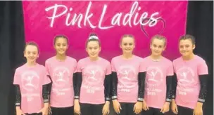  ?? Pictures: Tom Miladinovi­c ?? ●●Girls from Rochdale Olympic Gymnastic Club wearing their pink t-shirts in memory of Marianne Haboc, below