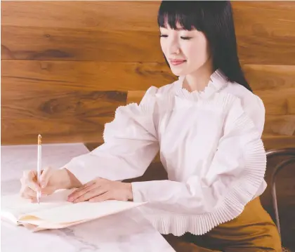  ?? PHOTOS: KONMARI MEDIA ?? Marie Kondo is known for her Netflix show and book about declutteri­ng. Her latest book is aimed at readers who want to organize their profession­al life.
