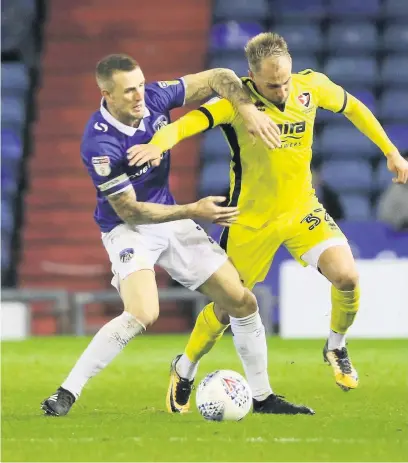  ?? Picture by Antony Thompson - Thousand Word Media ?? Luke Varney, right, tangles with Oldham’s Peter Clarke