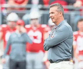  ?? GREG BARTRAM/USA TODAY SPORTS ?? Ohio State head coach Urban Meyer, now on paid leave, watched the Buckeyes compete in the spring game at Ohio Stadium.