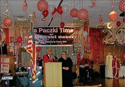  ?? CAROL HARPER — ?? Tim and Terri Kiedrowski welcome about 500 guests to a 20th annual Paczki Ball Feb. 19, at Deluca’s Place in the Park on Broadway Avenue in Lorain. The couple own Kiedrowski’s Simply Delicious Bakery at 2267 Cooper Foster Park Road in Amherst.