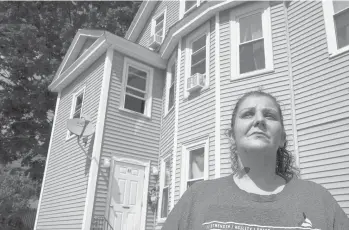  ?? STEVEN SENNE/AP ?? Roxanne Schaefer, of West Warwick, Rhode Island, shown outside her apartment building Tuesday, is $3,000 behind on rent after her girlfriend lost her job. She’s bracing for the end to a CDC federal moratorium Saturday.