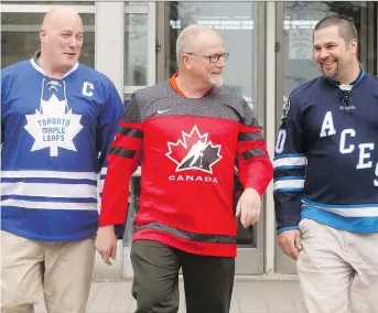  ?? JULIE OLIVER ?? From left, paramedics Tim Trumble from Osgoode, Mike Moulton from Woodstock and Steve Osipenko from Renfrew wore sports jerseys to a conference in Ottawa on Thursday.