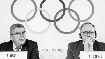  ??  ?? Internatio­nal Olympic Committee (IOC) president Thomas Bach (left) and chairman of IOC Inquiry Commission into alleged Russian doping at Sochi 2014 Swiss Samuel Schmid attend a press conference following an executive meeting on Russian doping in...