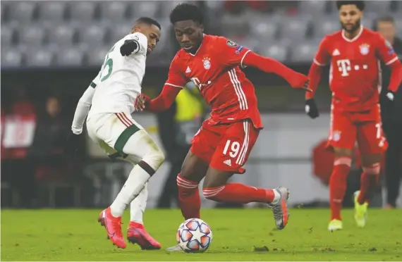  ?? REUTERS/ANDREAS GEBERT ?? Bayern Munich's Alphonso Davies, pictured in action against Lokomotiv Moscow on Dec. 9, was named one of the best 11 players on the planet last season.