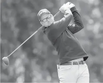  ?? MIKE CARLSON, THE ASSOCIATED PRESS ?? Canada’s Corey Conners tees off on the 11th hole during the first round of the Valspar Championsh­ip Thursday in Palm Harbor, Florida. Conners finished with a 67.