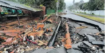  ?? Photo: Jon Ivins ?? Major infrastruc­ture damage in John Zikhali Road, Durban.