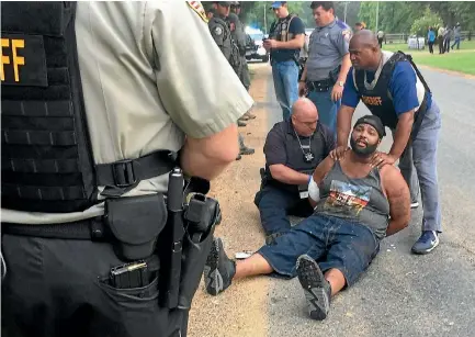  ?? PHOTO: REUTERS ?? Willie Corey Godbolt is arrested near Brookhaven following a shooting rampage in Lincoln County, Mississipp­i.